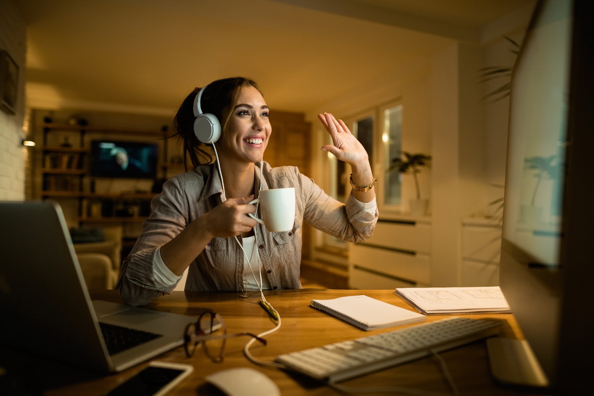A student waving during a live online session